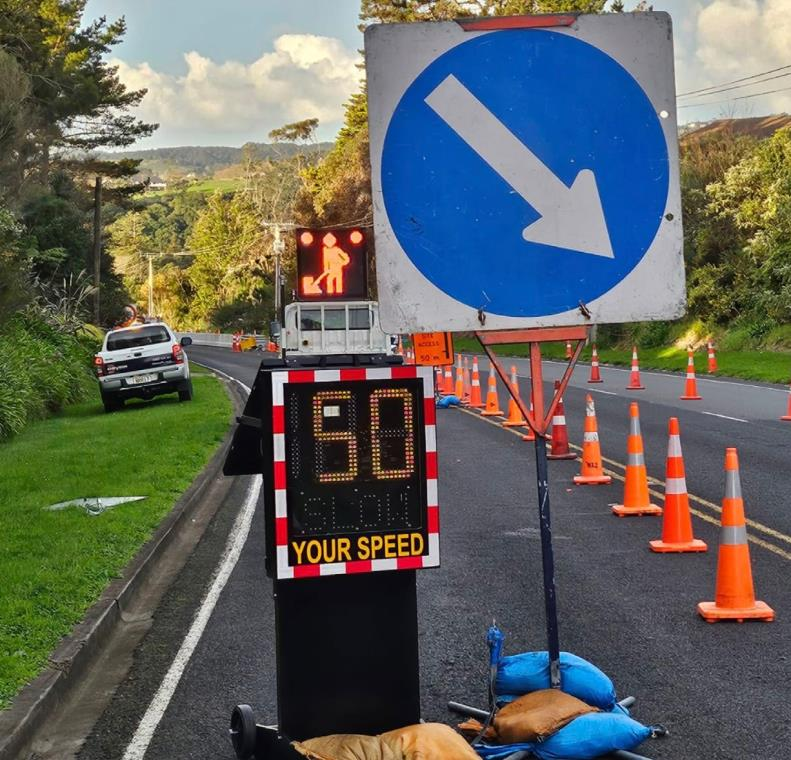 Temporary speed sign displaying vehicle speed on a roadwork site