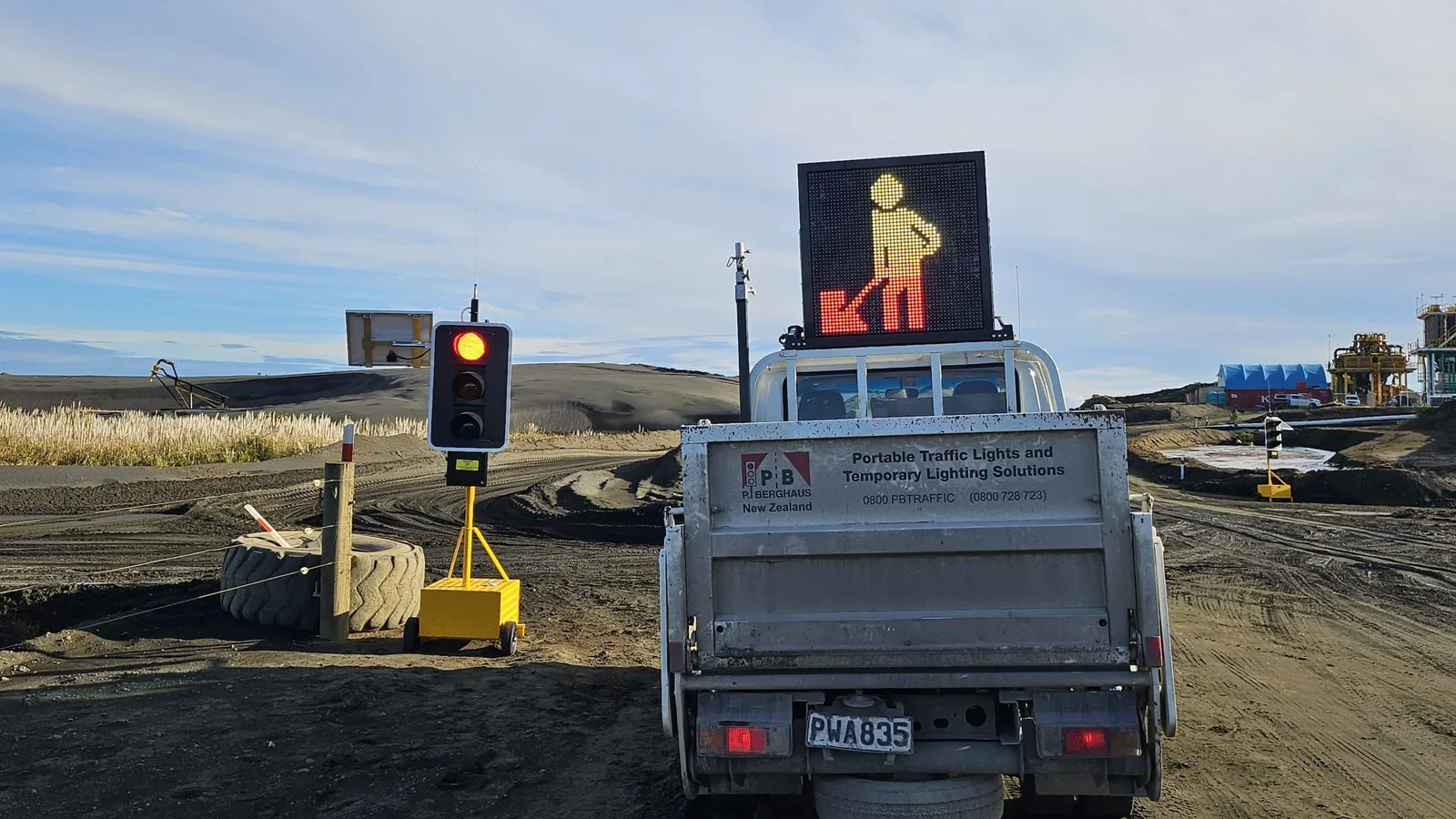 Truck mounted warning board and portable traffic light on a traffic control site